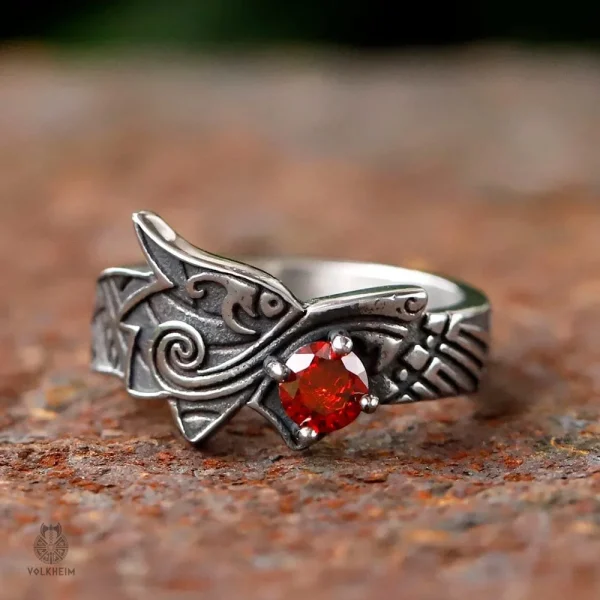 Bague en métal avec design dragon et gemme rouge