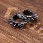 Boucles d'oreilles tête de mort avec pointes élégantes