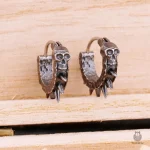 Boucles d'oreilles stylées tête de mort, design edgy